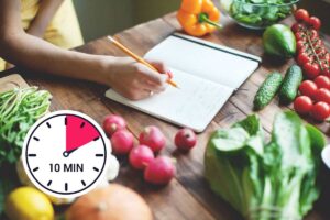 Timer dieci minuti, verdure, mano che scrive su un quaderno